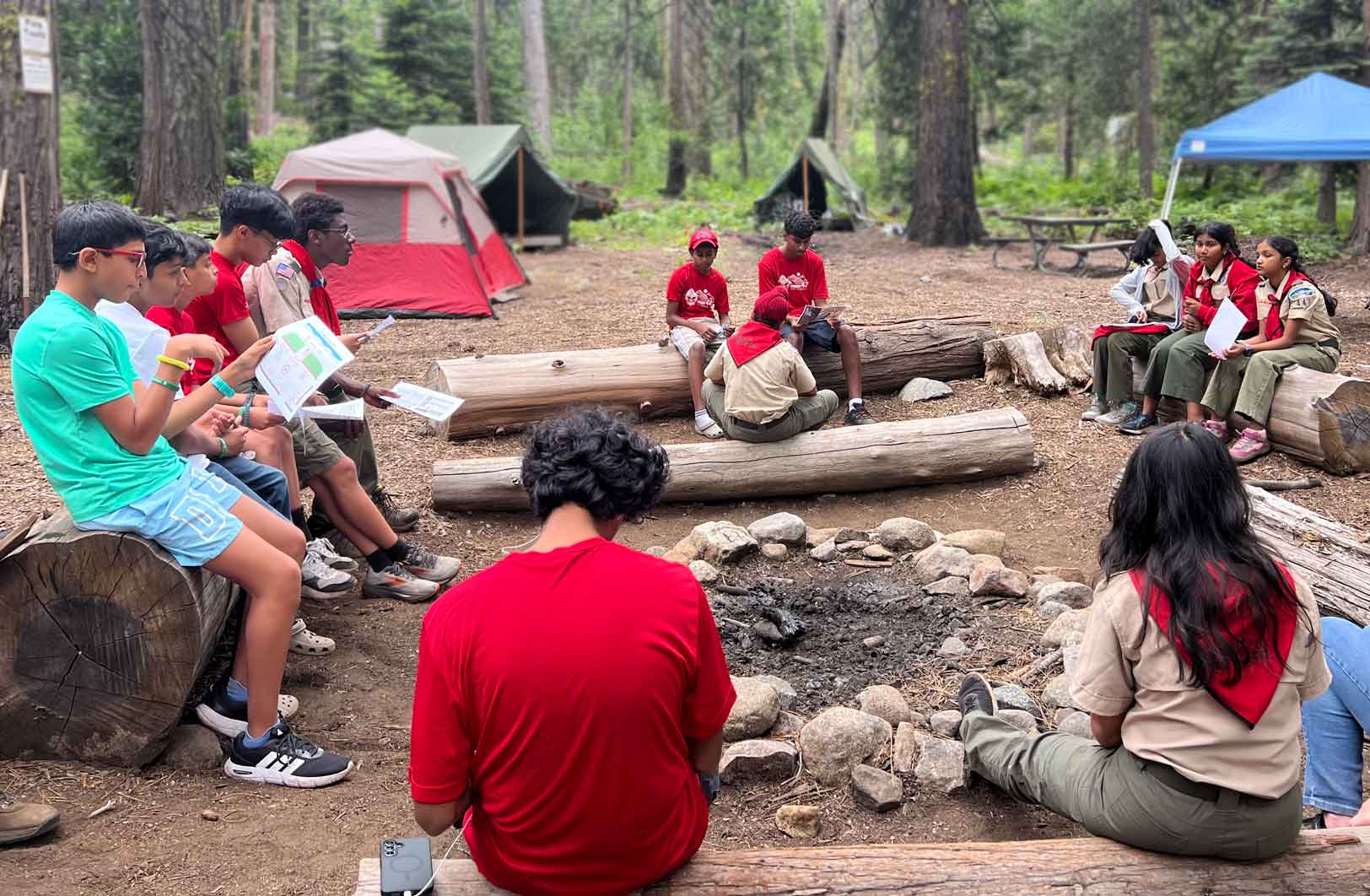 Troop 447 Scouts gathered around a campsite