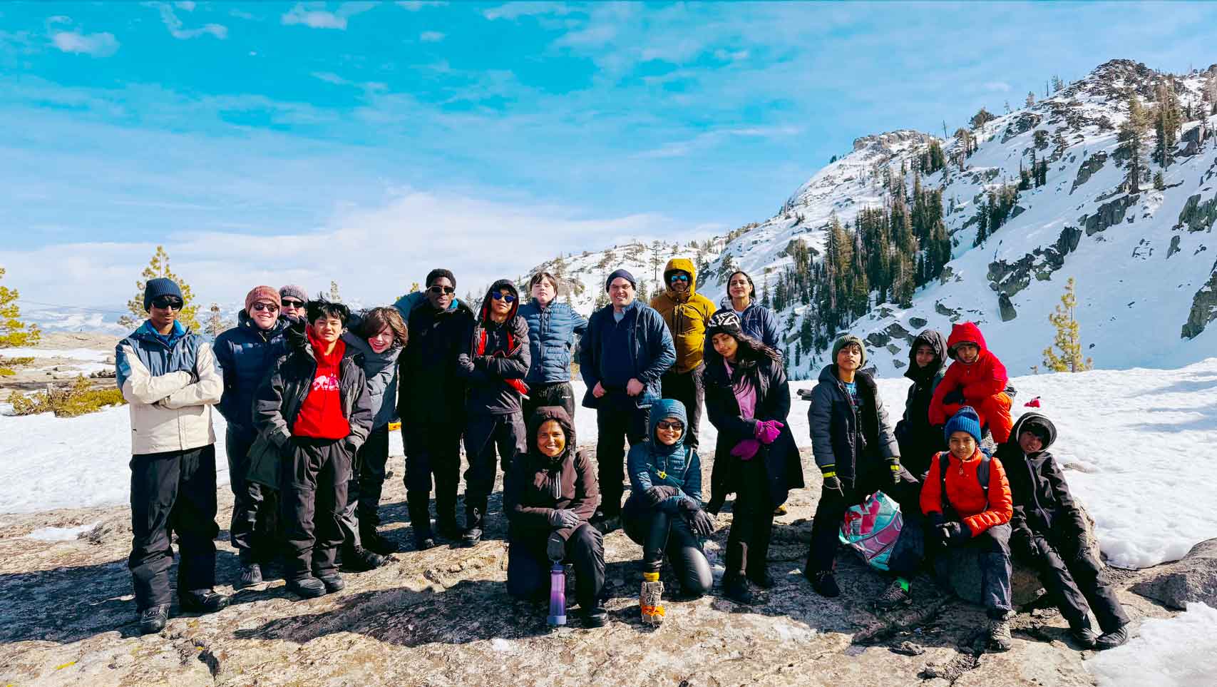 Troop 447 Scouts and families on a mountaintop covered in snow